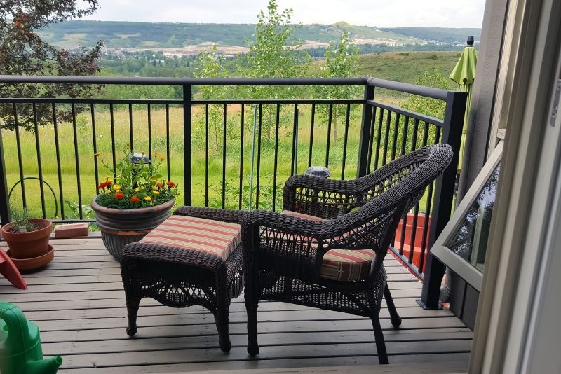 Patio area with a rattan-style outdoor chair