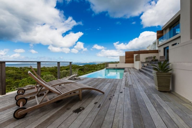 Timber deck surrounding an outdoor pool with ocean views